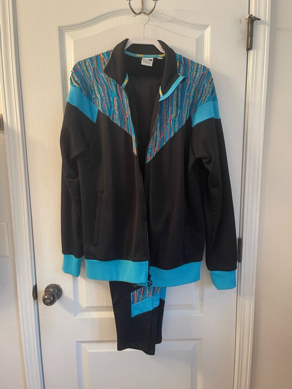 Coogi and Fendi collab track suit. Too and bottom.